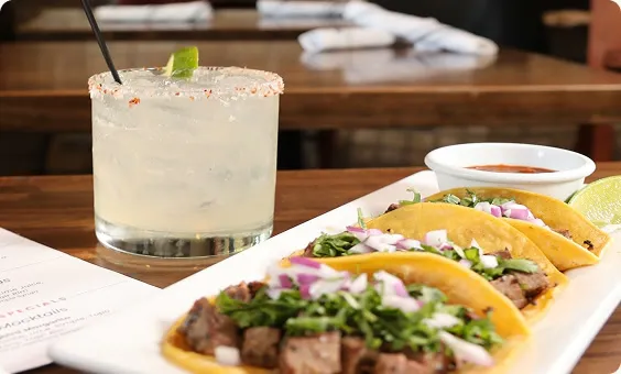 Street tacos with a margarita