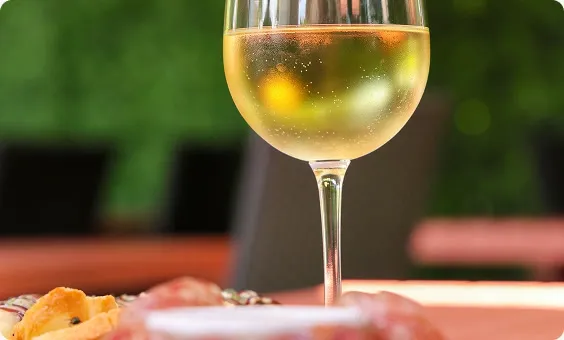 A glass of white wine on the patio